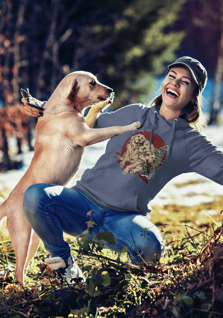 Woman wearing Rose Jane Designs Cerberus Hoodie playing with golden retriever